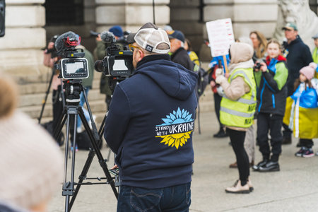 02.28.2023 - Nottingham, United Kingdom - cameraman taking the Ukrainian solidarity campaign. High quality photoのeditorial素材