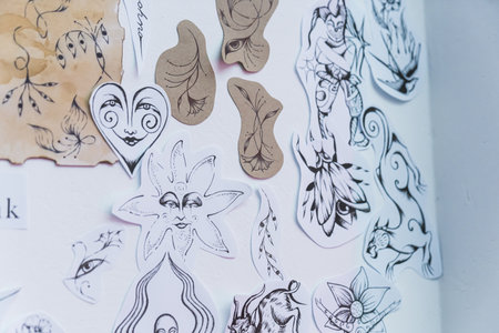 06.06.2023. Warsaw, Poland. cute hand-made sketches on the whiteboard in the tattoo studio. High quality photoのeditorial素材