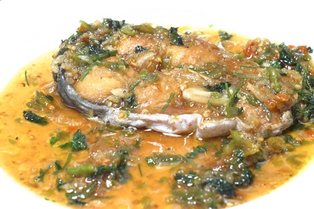 fried Spanish mackerel topped with chili sauceの写真素材