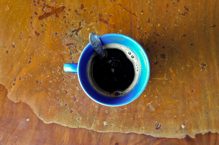 black coffee on the old tableの写真素材