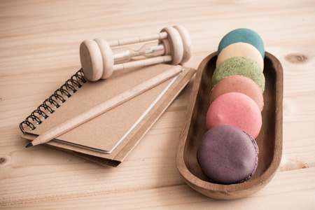 Macarons on wooden table and vintage color toneの写真素材