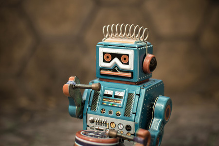 Retro robot toy, vintage color style, vintage tone background.の写真素材