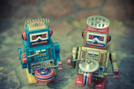 Retro robot toy, vintage color style, vintage tone background.の写真素材