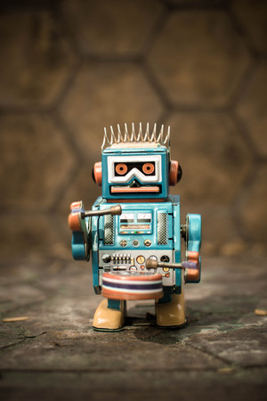 Retro robot toy, vintage color style, vintage tone background.の写真素材