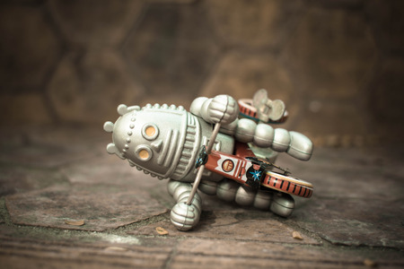 Retro robot toy, vintage color style, vintage tone background.の写真素材
