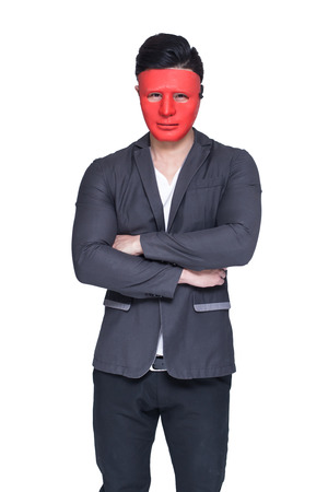 Businessman with red mask concept, isolated on white backgroundの写真素材