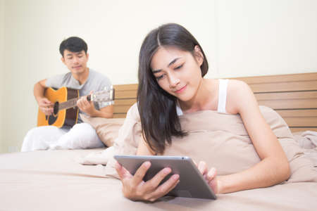 Asian couple man and woman lifestyle in the room. lifestyle people concept.の写真素材