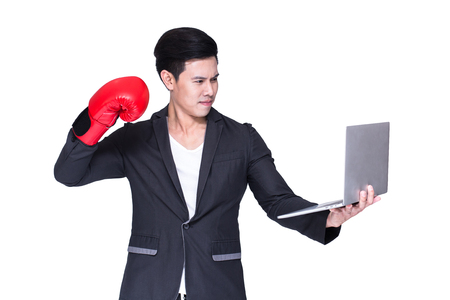 Young asian handsome businessman try to fight business, isolated on white backgroundの写真素材