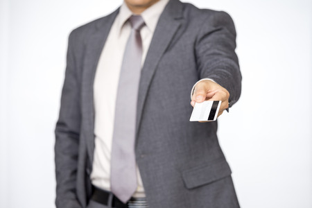 Businessman holding cradit card, business finance concept, isolated on white background.の写真素材
