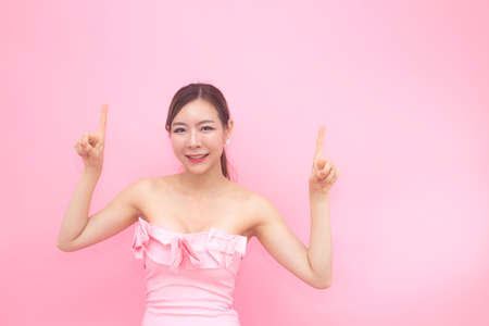 Korean woman fashion set sweet pink sexy girl, woman with skin care concept, isolated with pink background, 20-30 year old.の写真素材