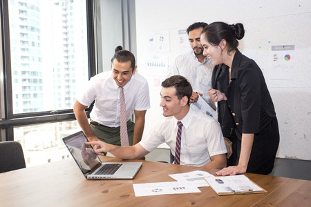 Young businessman present business plan with team at meeting room, man with leader concept, 20-30 years old.の写真素材