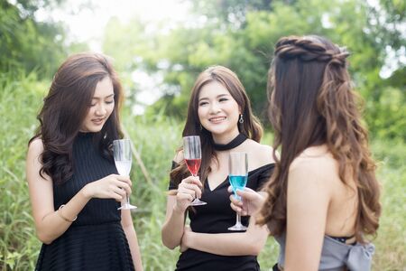 Group of asian woman wear sexy dress with party at outdoor place, woman party concept.の写真素材
