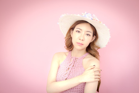 Beautiful korea woman posing at pink background with summer concept, isolated on pink background, 20-30 year old.の写真素材
