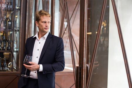 Portrait of a handsome Businessman Standing in restaurant, Man with Business Concept.