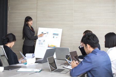 Asian Business Woman presenting her work with team at the meeting room, People working Concept.の写真素材