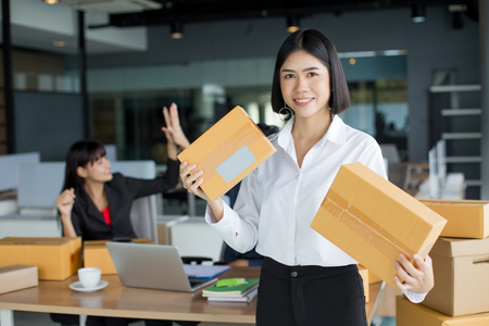 Young Asian Woman holding box with smiling together, Young Owner Woman Start up for Business Online, SME, Delivery Project, Woman successful with Online Business or SME Concept.の写真素材