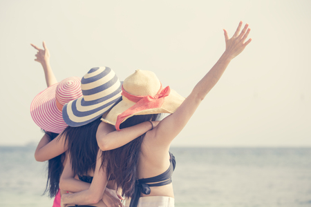 Portrait of Behind Woman Group posing at the Beach, People with Summer Concept. Vintage Tone.の写真素材