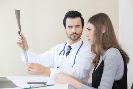 Portrait of Dooctor holding films x-ray and checking at hospital. People with medical concept.の写真素材