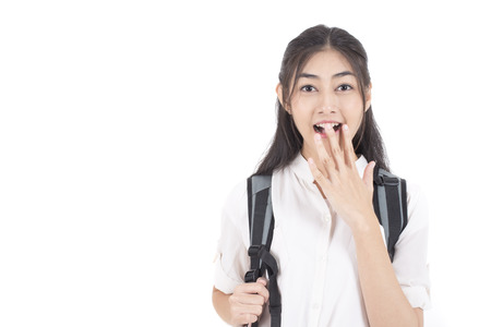 Portrait of Beautiful Young Asian Woman student with surprise emotion isolated on whiteの写真素材