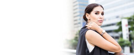 Young Beautiful business woman in city looking out and thinking about work. Young business woman with leader concept. White female thinking about business concept. banner size with copyspace.の写真素材