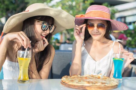 Beautiful Asian Woman have dinner at reataurant with friend, People Lifestyle Concept.の写真素材
