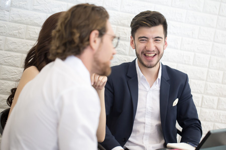 Businesspeople Sitting in office and Work Together with Smiling. Businessman have a Meeting with Team. Businesspeople Working concept.の写真素材