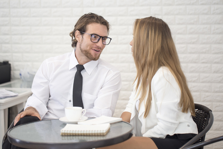 Businessman Present for Marketing Plan with Team at Cafe, People Working Concept.の写真素材