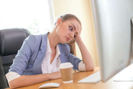Business woman boring when she work at office. Woman working over time with stress situation. People working concept.の写真素材