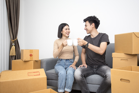 Asian people moving home with happy emotion together. People lifestyle concept.の写真素材