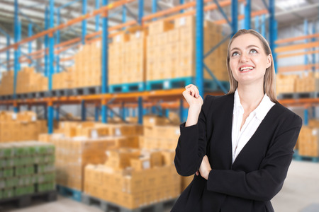Businesswoman standing at warehouse background.の写真素材