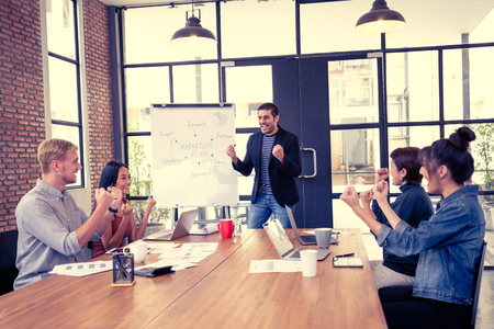 Business people have meeting together at office. Businessman present the project with happy emotion. People working together with casual style at modern office.  Vintage tone.の写真素材