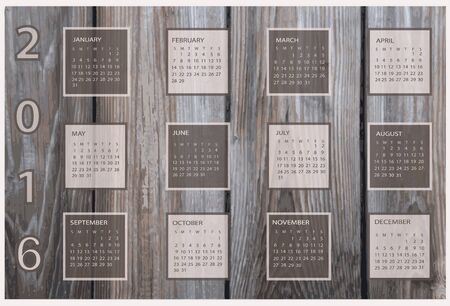 Calendar for 2016 on wood background.