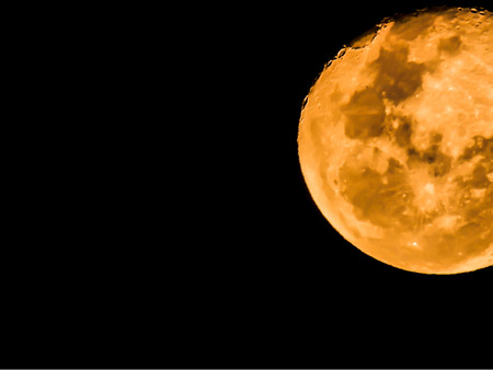 closeup beautiful moon on black backgroundの写真素材