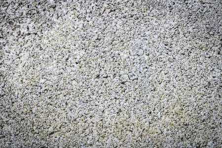 grey bumpy cement concrete wall background textureの写真素材