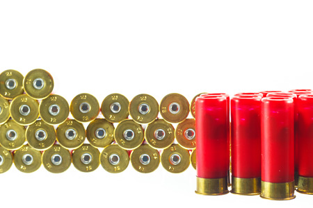 A red shotgun shell bullet on a white background.の写真素材