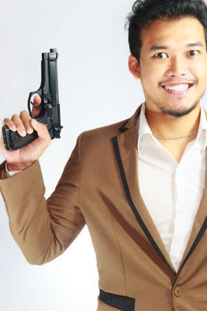 Mature Business Man Holding Gunの写真素材