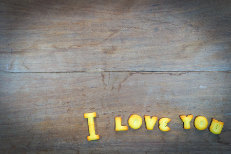 i love you text  by dessert on wooden backgroundの写真素材