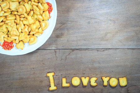 i love you text  by dessert on wooden backgroundの写真素材