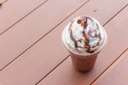Ice cocoa churn on wooden table