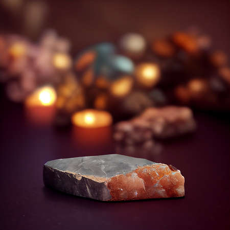 Natural stone on a dark background with candles and bokeh.の写真素材