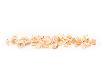 Color pencil shaves in line on a white paperの写真素材