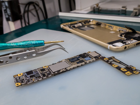Repairing Smart Phone on Desk, Selective Focusの写真素材
