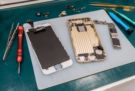 Repairing Smart Phone on Desk, Selective Focusの写真素材