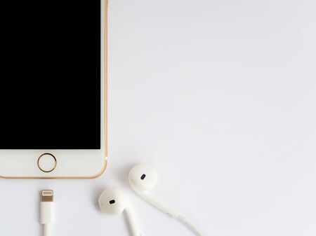 CHIANGRAI, THAILAND -SEPTEMBER 9, 2016: Close-up image of new Apple iPhone7 mockup and new Apple EarPods mockup on white background.のeditorial素材