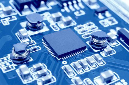 Closeup image of microprocessor on electronic circuit board. Blurred and toned image. Shallow DOF.の写真素材