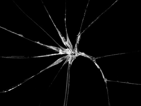 Cracked glass texture on black background. Isolated realistic cracked glass effect.
の写真素材