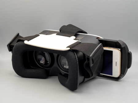 Packshot image of smartphone and virtual reality headset (VR Box) on gray backgroundの写真素材