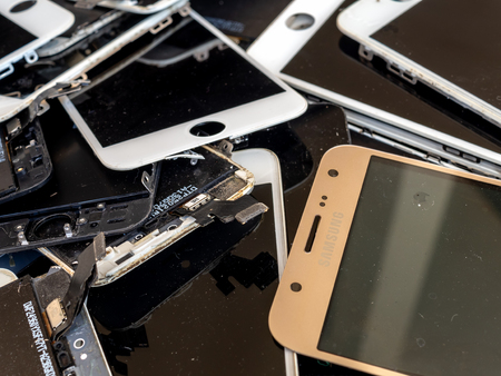 Chiang Rai, Thailand: August 23, 2017 - heap of broken smartphone screen (e-waste, electronic-waste)の写真素材