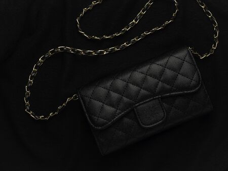Close-up and top view of elegance women's accessories fashion black shoulder leather bag with golden chain.の写真素材