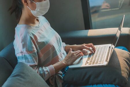 Beautiful Asian woman wearing medical hygiene protective mask for health care from Coronavirus...
